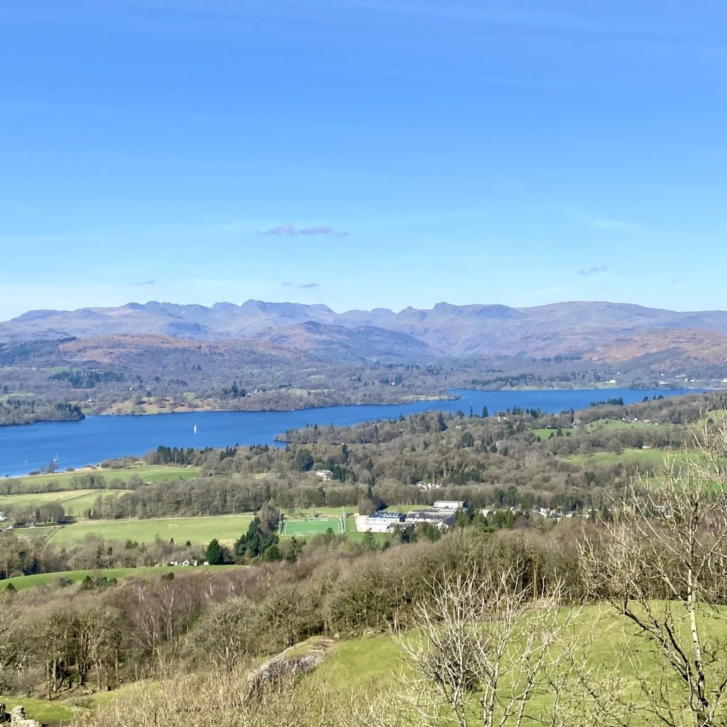 A view of Lake Windermere with mountains in the background, from Orrest Head
