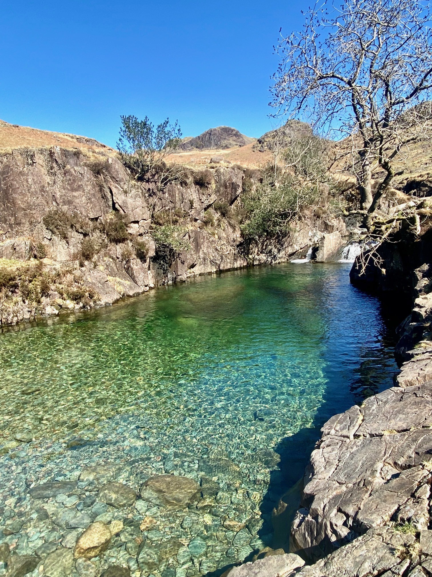 A beautiful view of Tongue Pot, turquoise clear water with a little waterfall