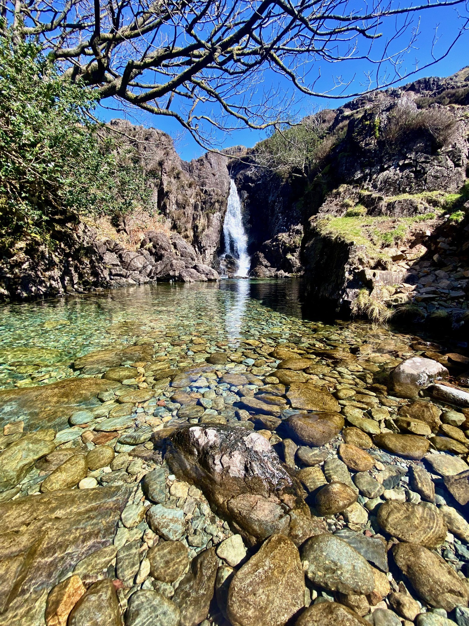 A beautiful waterfall and clear water in Esk Falls in The Lake District.