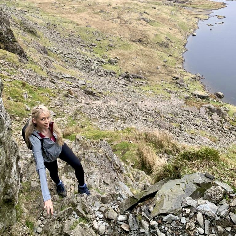 A woman climbing Jack's Rake in Langdale