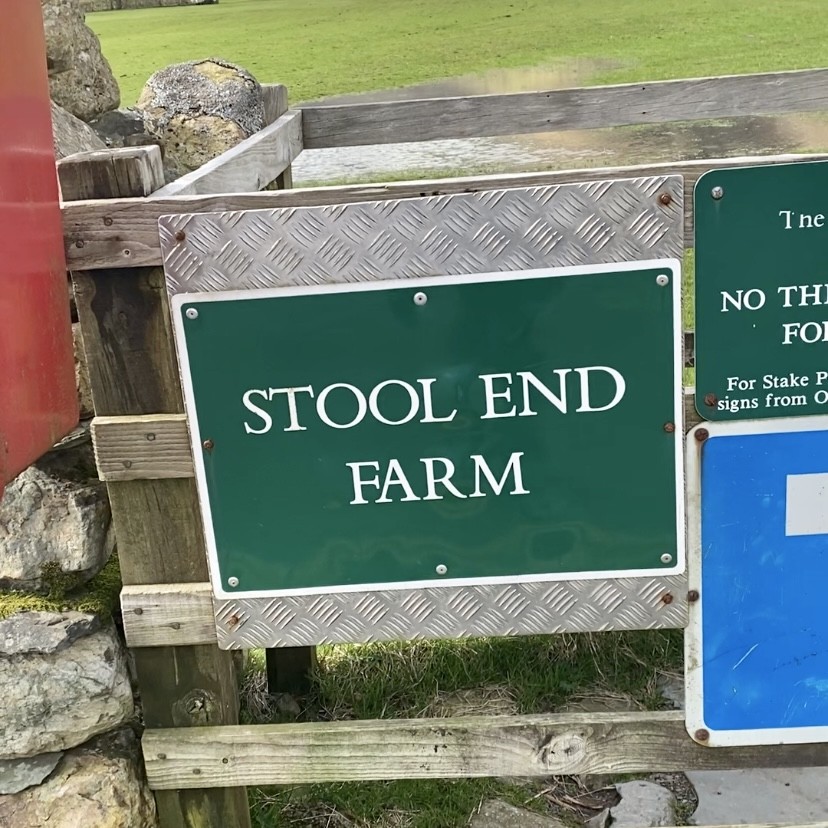 A sign to Stool End Farm.