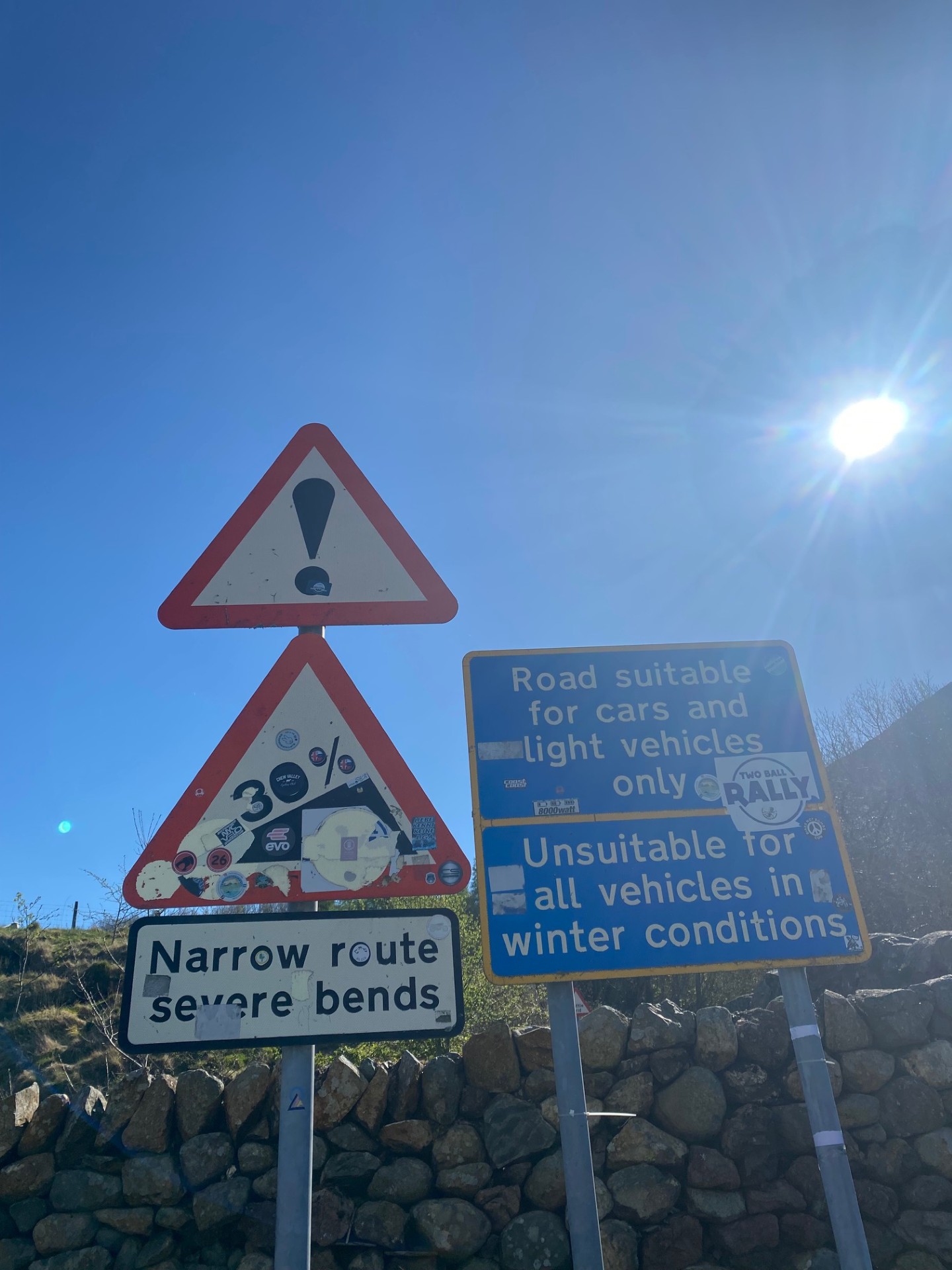 Road signs at the beginning of the Hardknott pass.