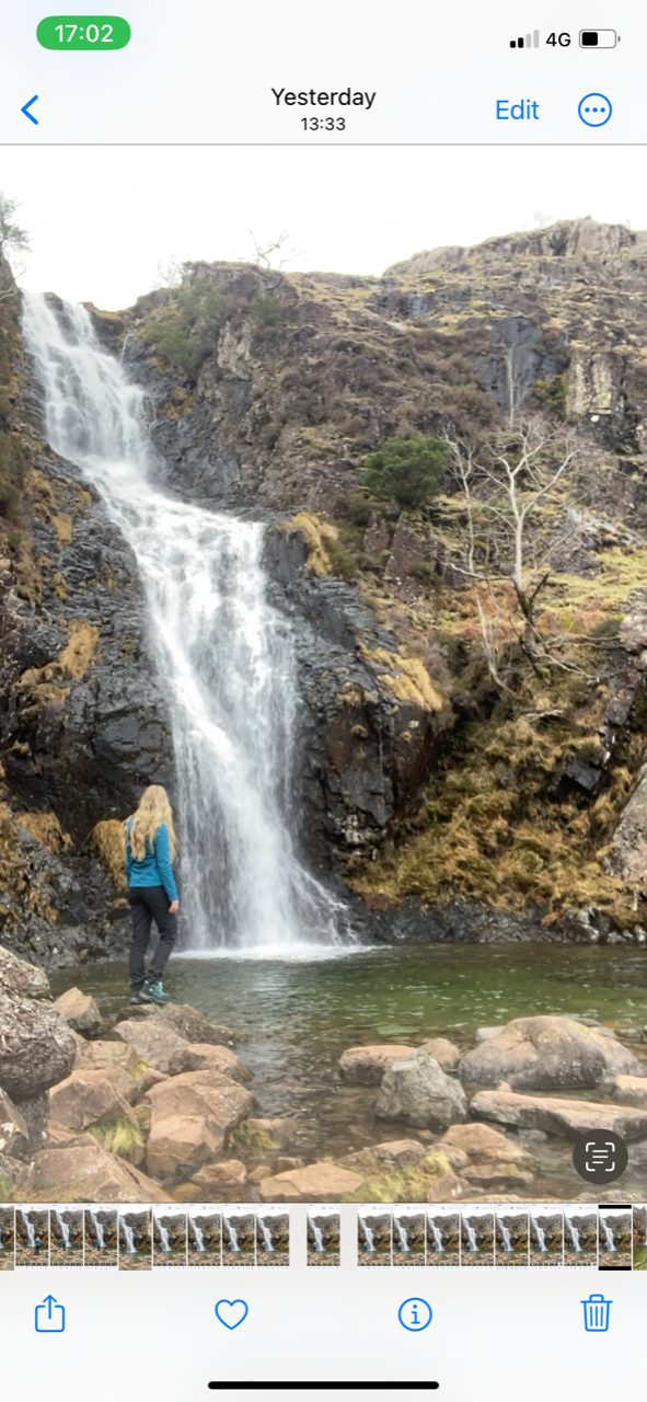 A woman standing in front of Whorneyside Force. 