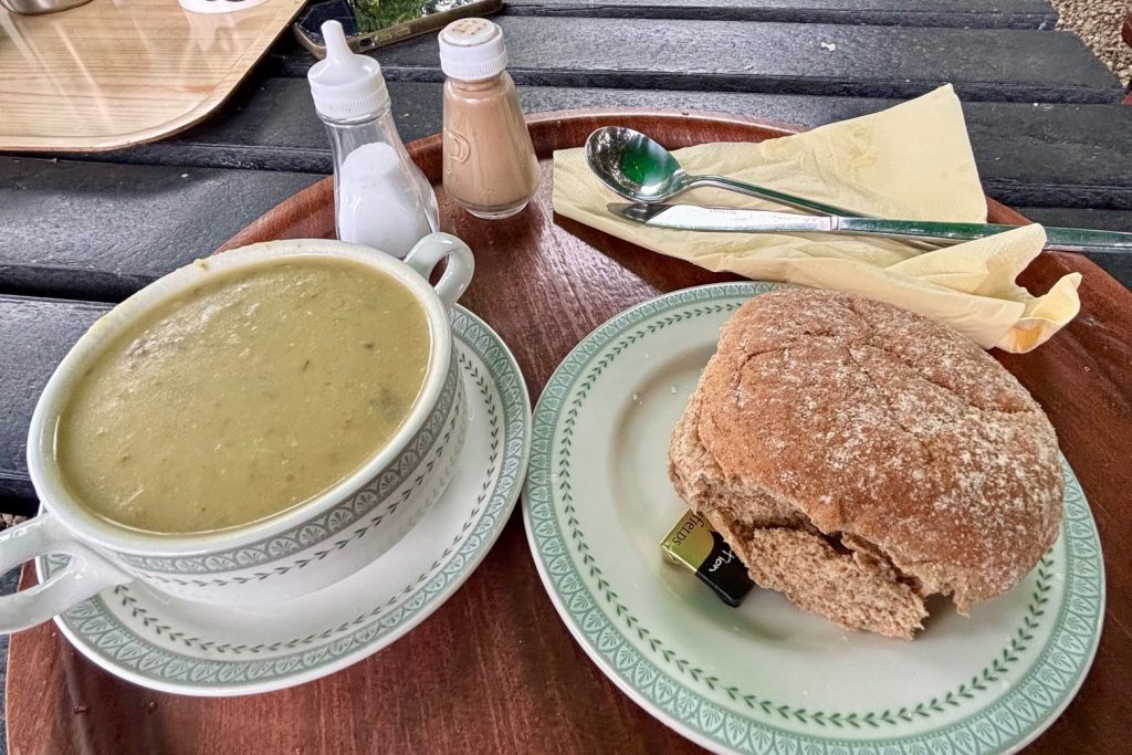 A bowl of leek and potato soup and a bread roll at the Caffle House Tearoom in Watendlath